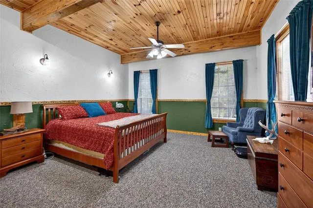 a bed room with a bed and a television