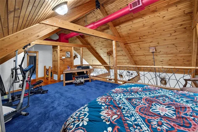 a view of a bedroom with gym equipment