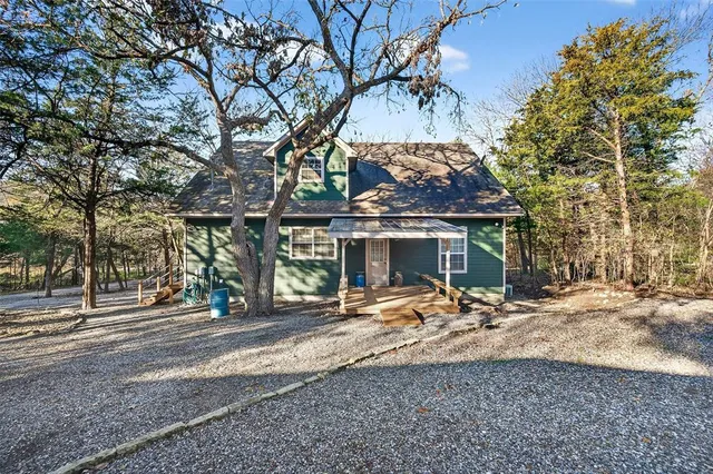 a view of a backyard with a sitting area