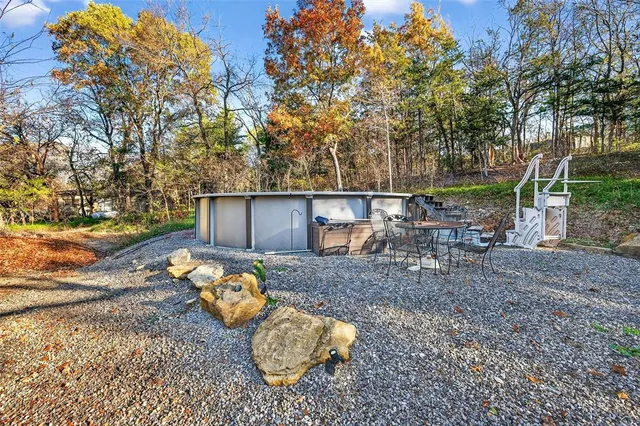 a view of a yard with large trees