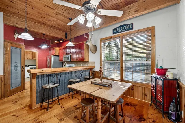 a room with lots of furniture and a chandelier