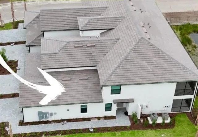 a view of a patio with table and chairs and potted plants