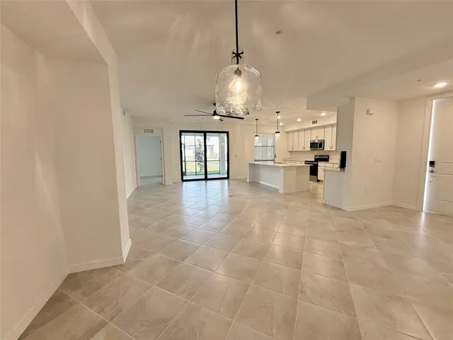 a view of a kitchen with a sink and cabinets