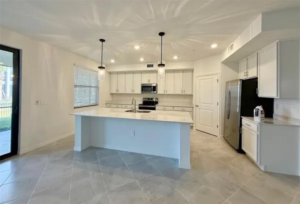 a large kitchen with cabinets