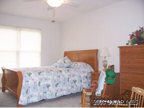 23 Meadow Ridge Road Waynesboro, VA 22980 - Photo 4 of 10 a bed sitting in a bedroom next to a window