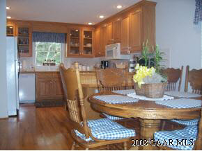 23 Meadow Ridge Road Waynesboro, VA 22980 - Photo 5 of 10 a dining room with furniture a potted plant and wooden floor