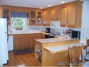 23 Meadow Ridge Road Waynesboro, VA 22980 - Photo 6 of 10 a kitchen with a stove a sink and a microwave