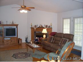 23 Meadow Ridge Road Waynesboro, VA 22980 - Photo 7 of 10 a living room with furniture a flat screen tv and a window