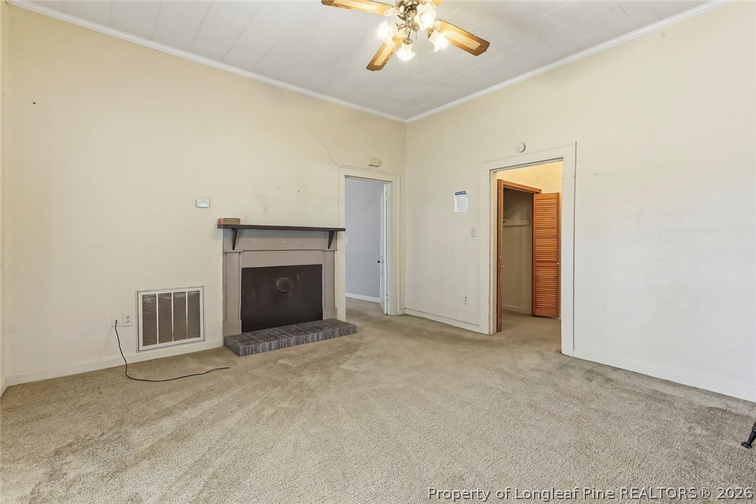 249 Nicholson Road Rockingham, NC 28379 - Photo 15 of 47 a view of an empty room with a fireplace