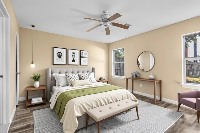 a bedroom with bed and a chandelier