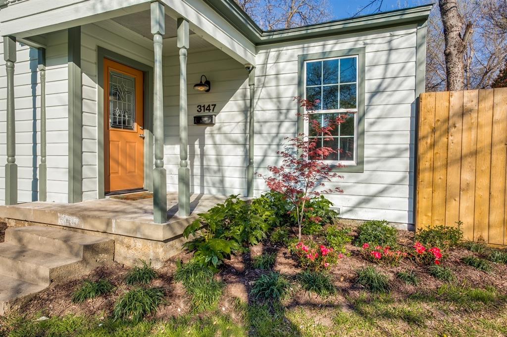 a view of a house with a small garden