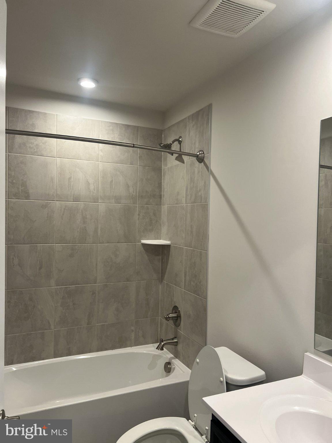 8058 Big Roundtop Road Fort George G Meade, MD 20755 - Photo 7 of 24 a bathroom with a bathtub and a shower