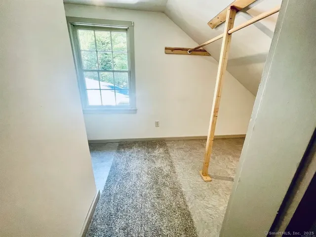 a house view with a sitting space and garden space