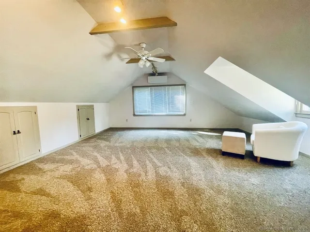 a view of entryway with a window and a rug