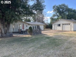 443 9th Street Metolius, OR 97741 - Photo 2 of 22 a front view of a house with a yard and garage