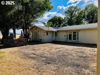 a house with trees in the background