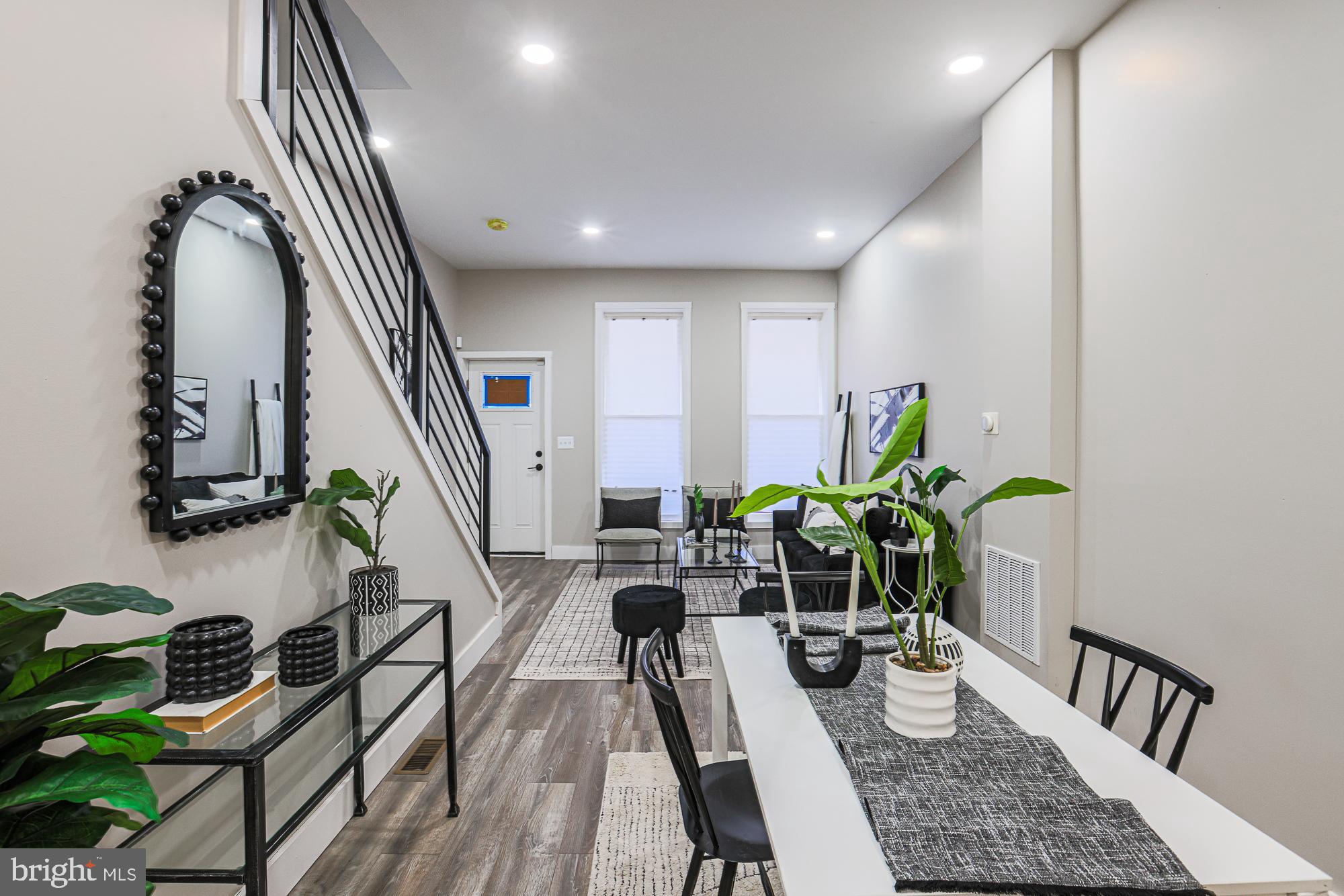 1728 Ruxton Avenue Baltimore, MD 21216 - Photo 12 of 43 a dining room with furniture and wooden floor