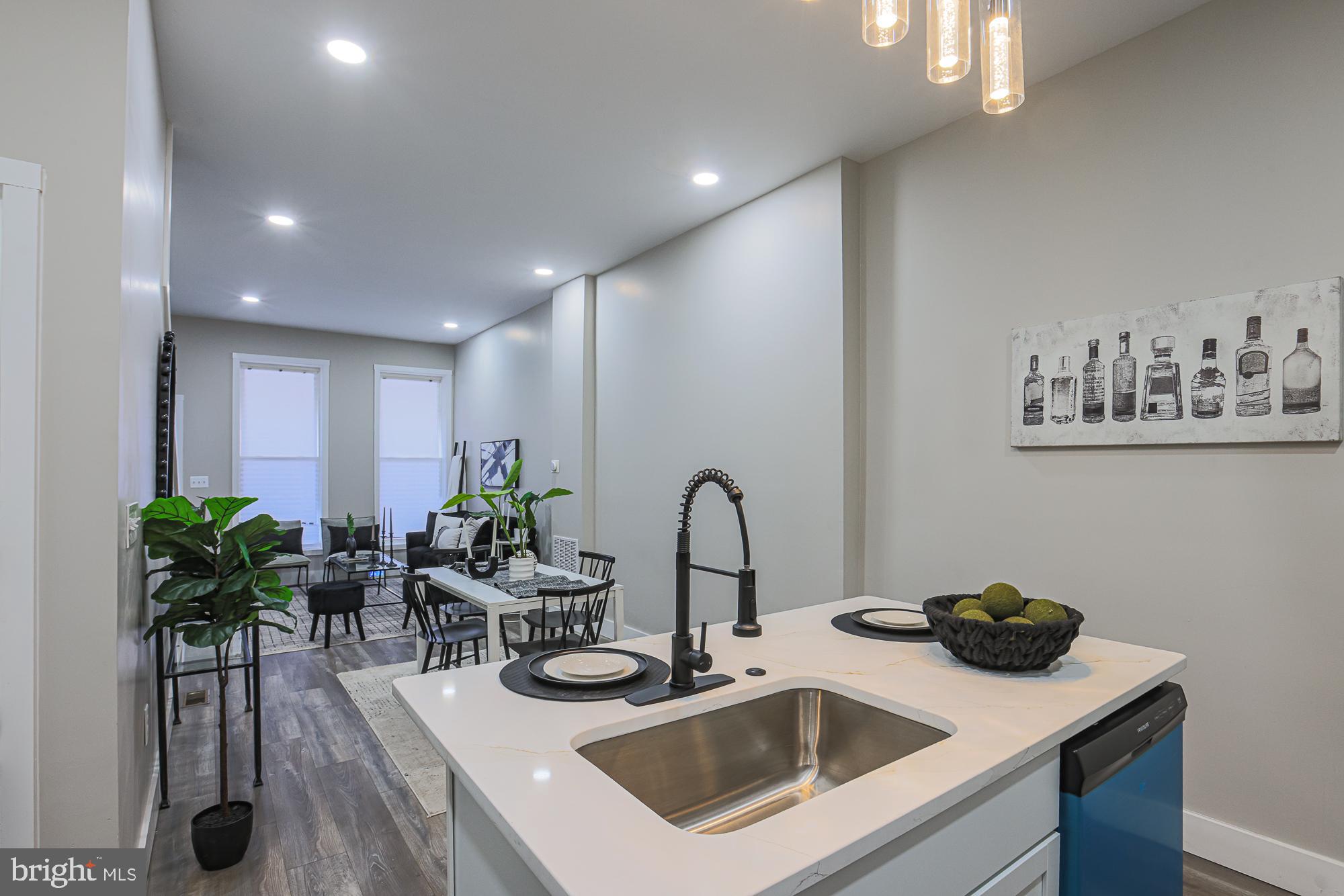 1728 Ruxton Avenue Baltimore, MD 21216 - Photo 43 of 43 a kitchen with a sink potted plant and appliances