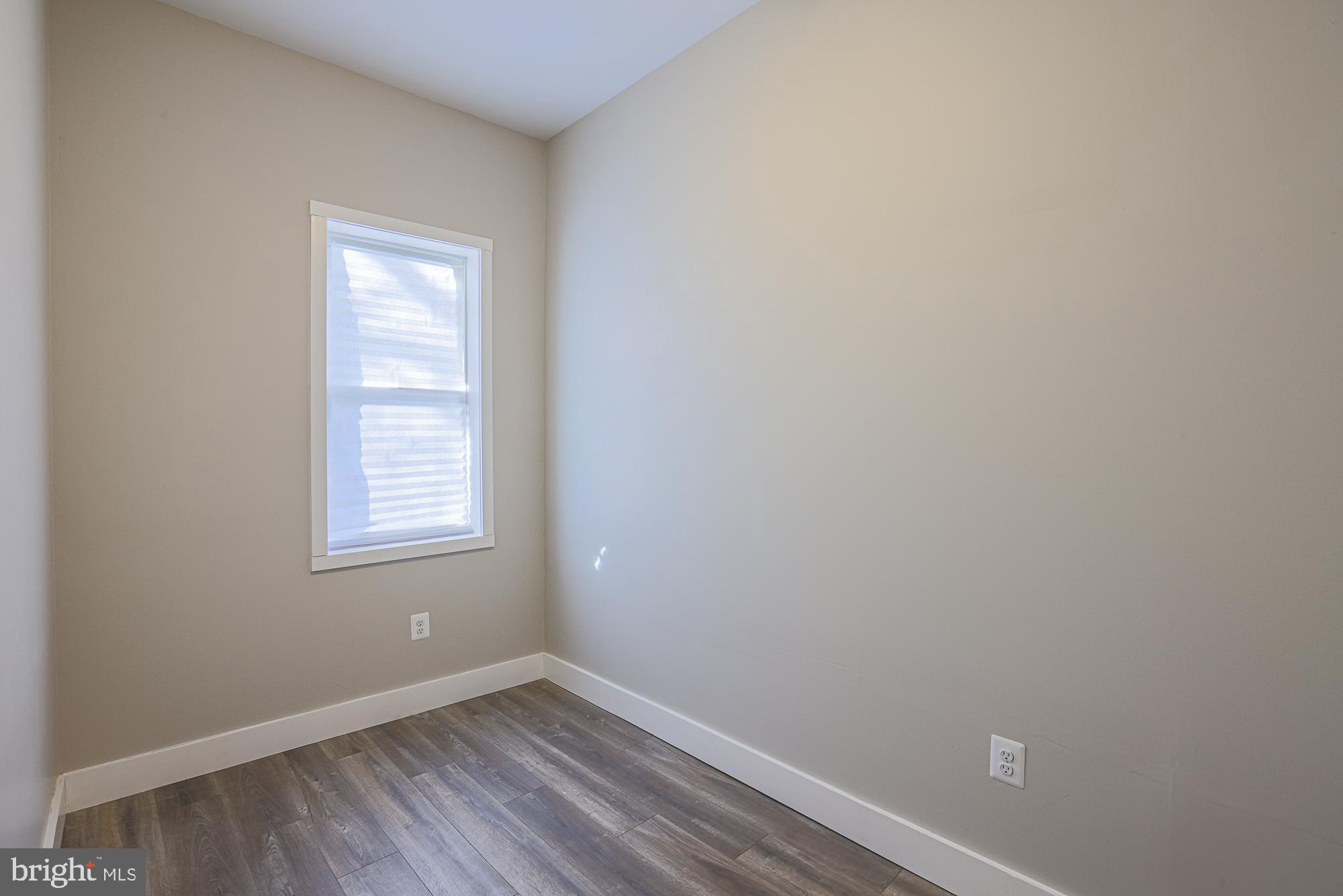 1728 Ruxton Avenue Baltimore, MD 21216 - Photo 18 of 43 an empty room with a window
