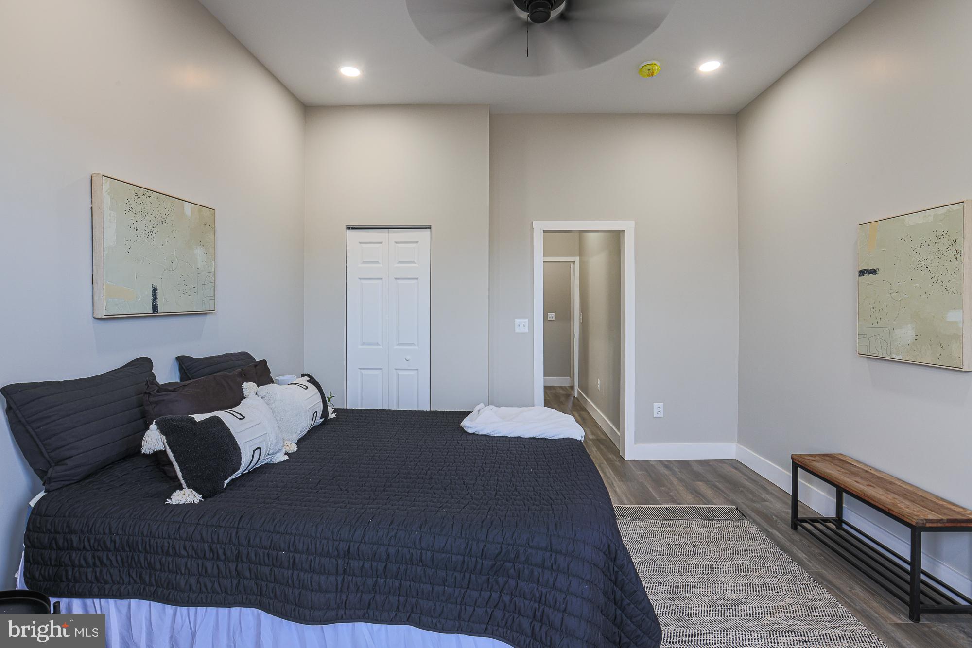 1728 Ruxton Avenue Baltimore, MD 21216 - Photo 22 of 43 a bed room with a bed and a couch