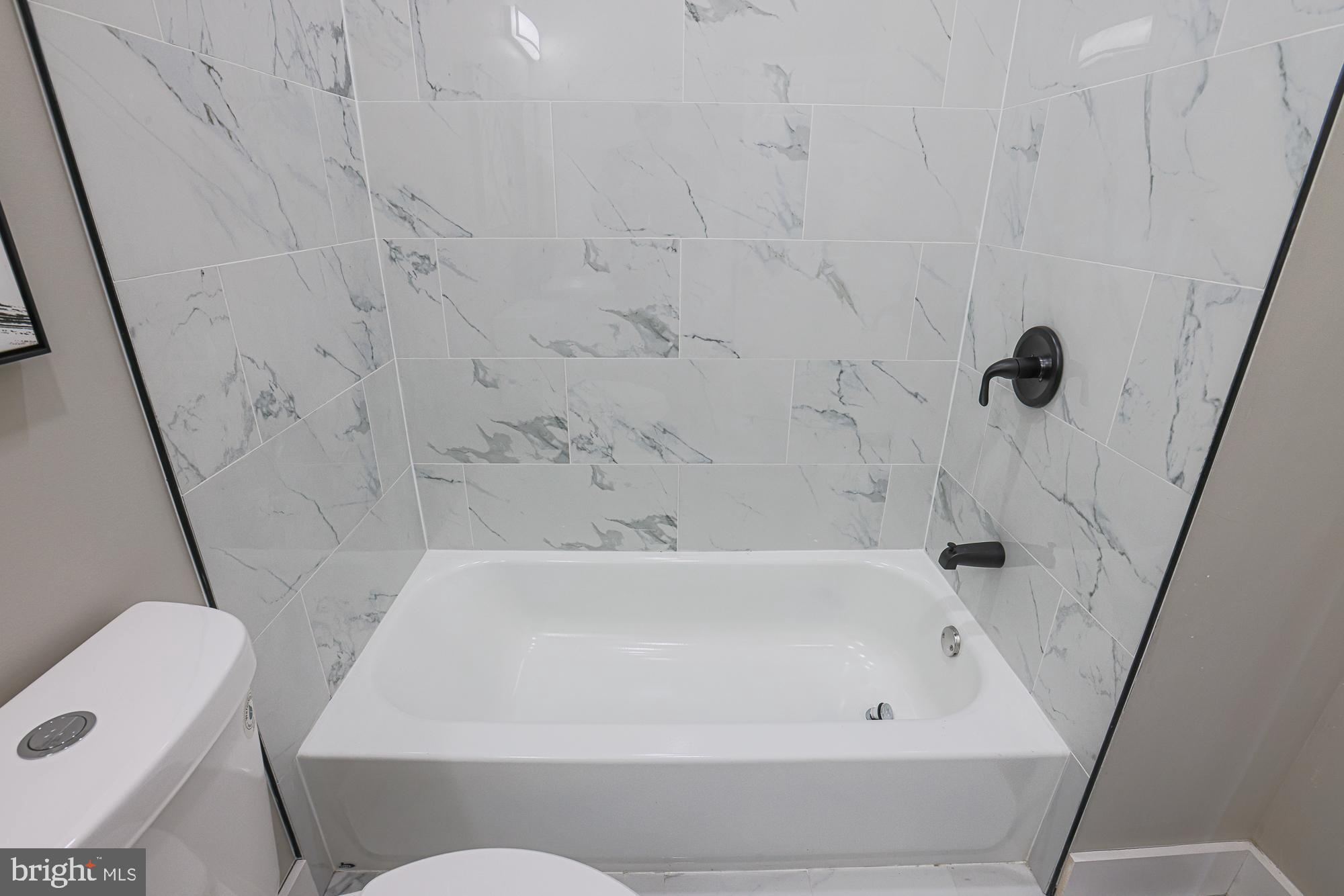 1728 Ruxton Avenue Baltimore, MD 21216 - Photo 25 of 43 a bathroom with a bathtub