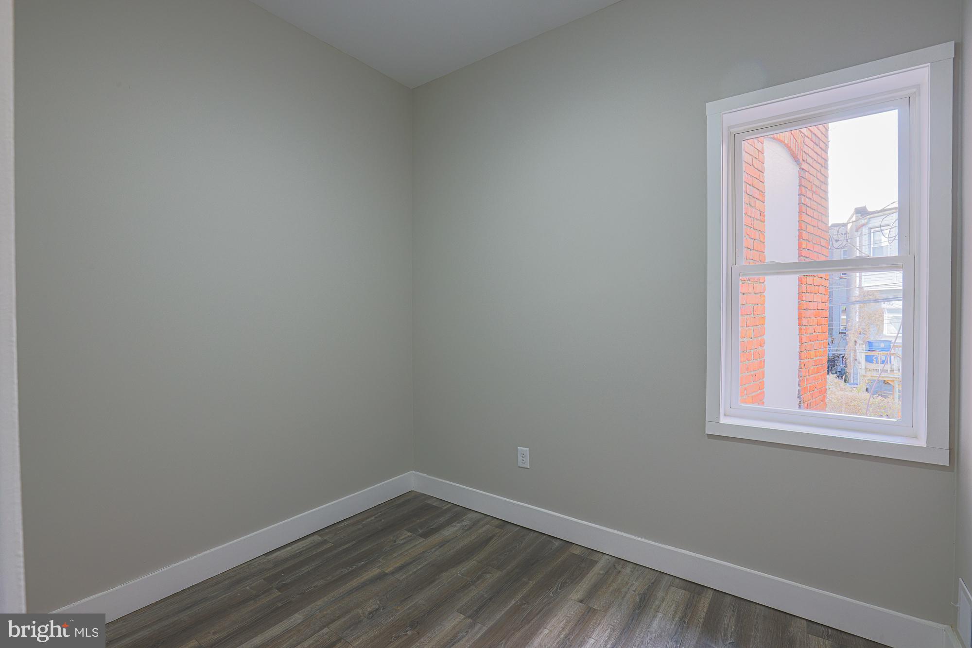 1728 Ruxton Avenue Baltimore, MD 21216 - Photo 30 of 43 an empty room with a window