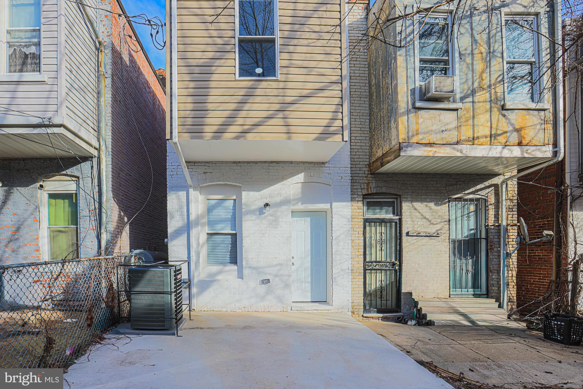 1728 Ruxton Avenue Baltimore, MD 21216 - Photo 37 of 43 a view of a brick house with a large windows
