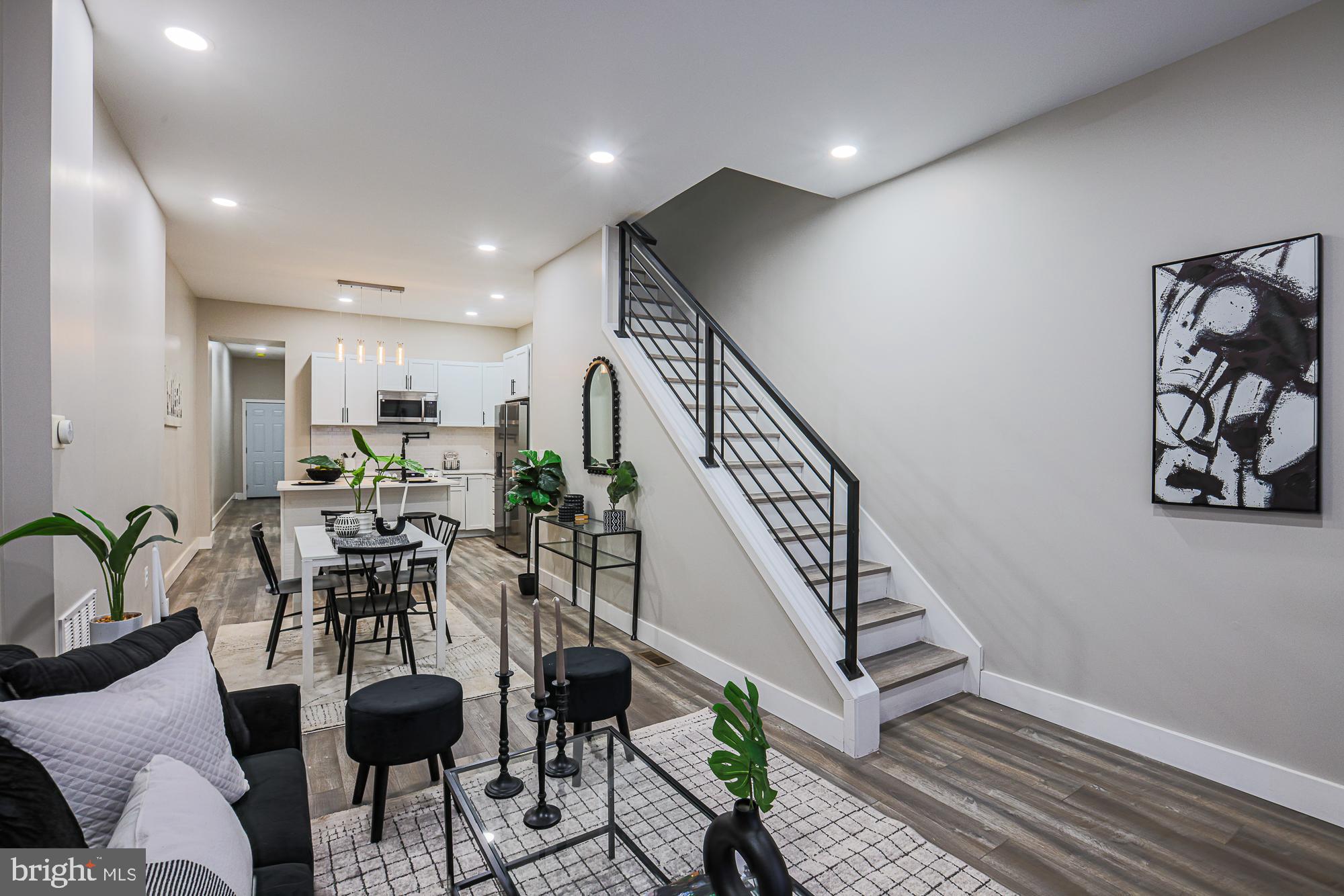 1728 Ruxton Avenue Baltimore, MD 21216 - Photo 4 of 43 a view of a livingroom with furniture and a potted plant