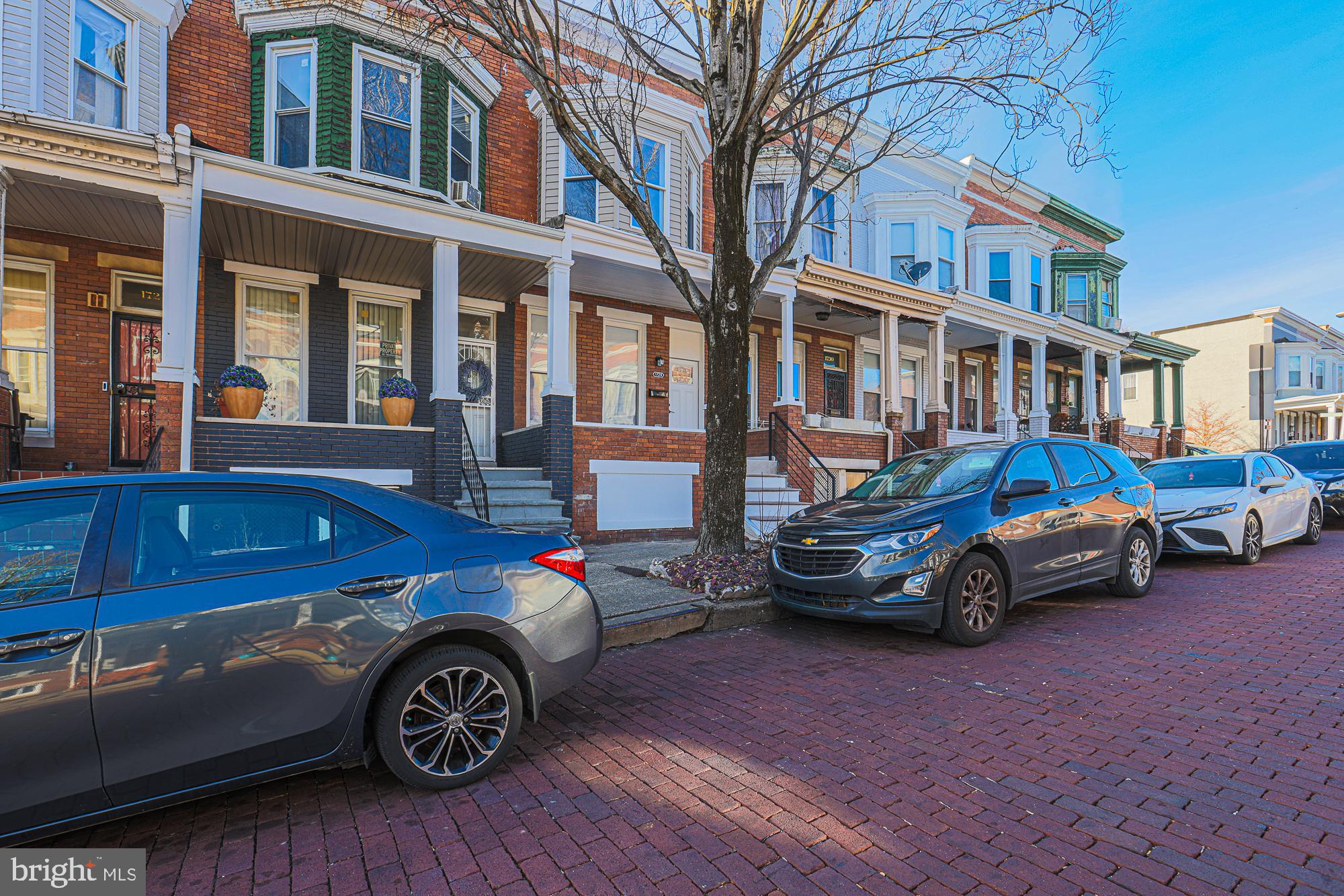1728 Ruxton Avenue Baltimore, MD 21216 - Photo 40 of 43 a car parked in front of a house