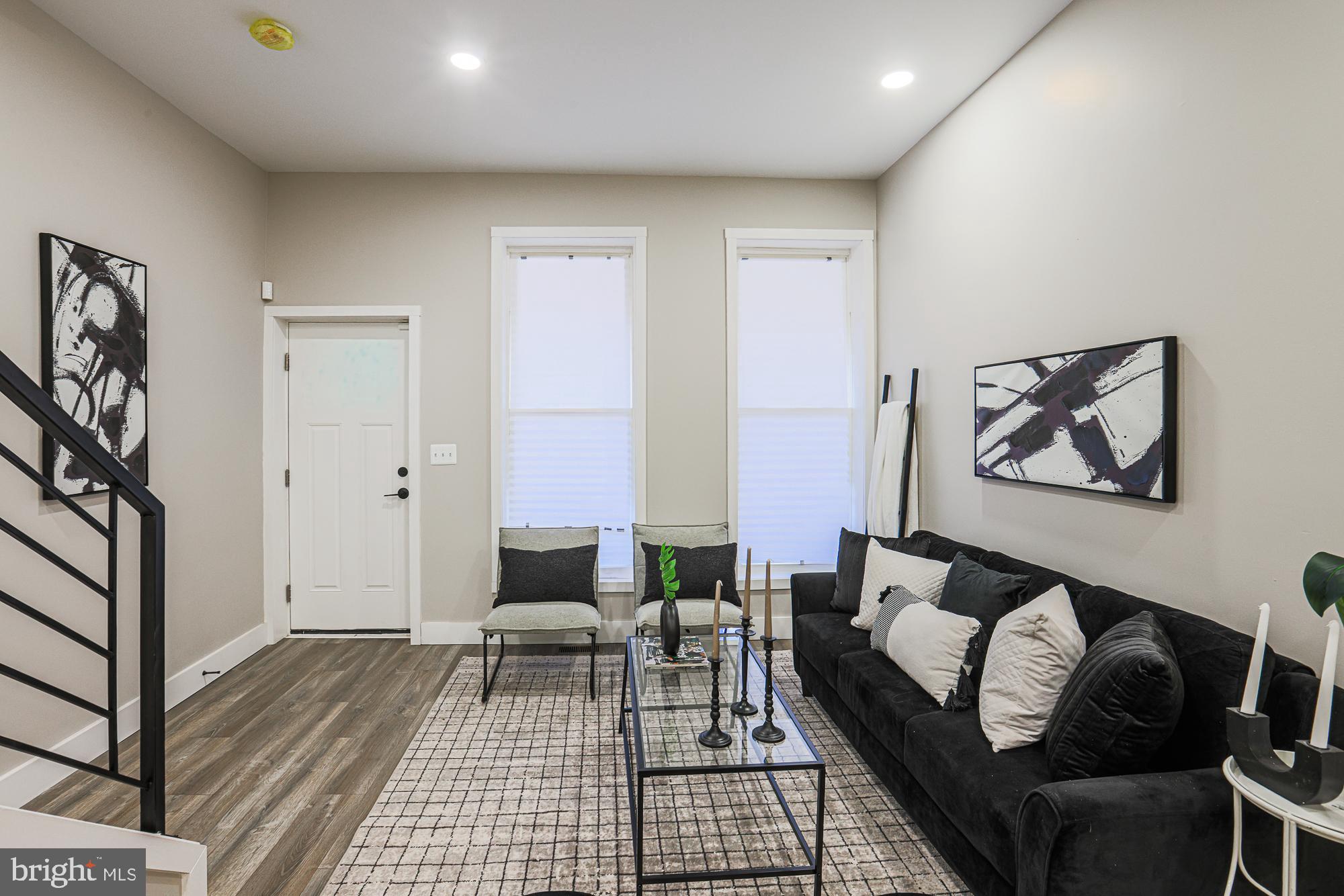1728 Ruxton Avenue Baltimore, MD 21216 - Photo 5 of 43 a living room with furniture and wooden floor