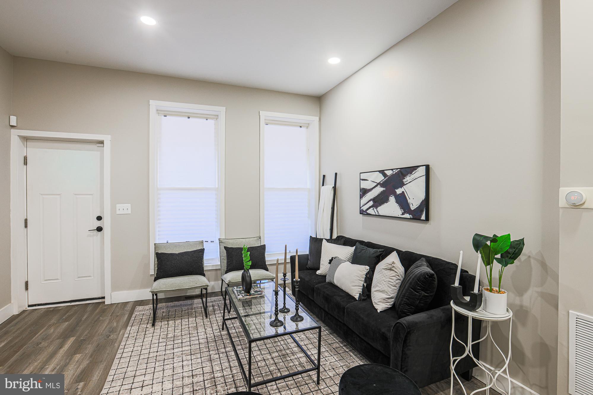 1728 Ruxton Avenue Baltimore, MD 21216 - Photo 6 of 43 a living room with furniture and wooden floor