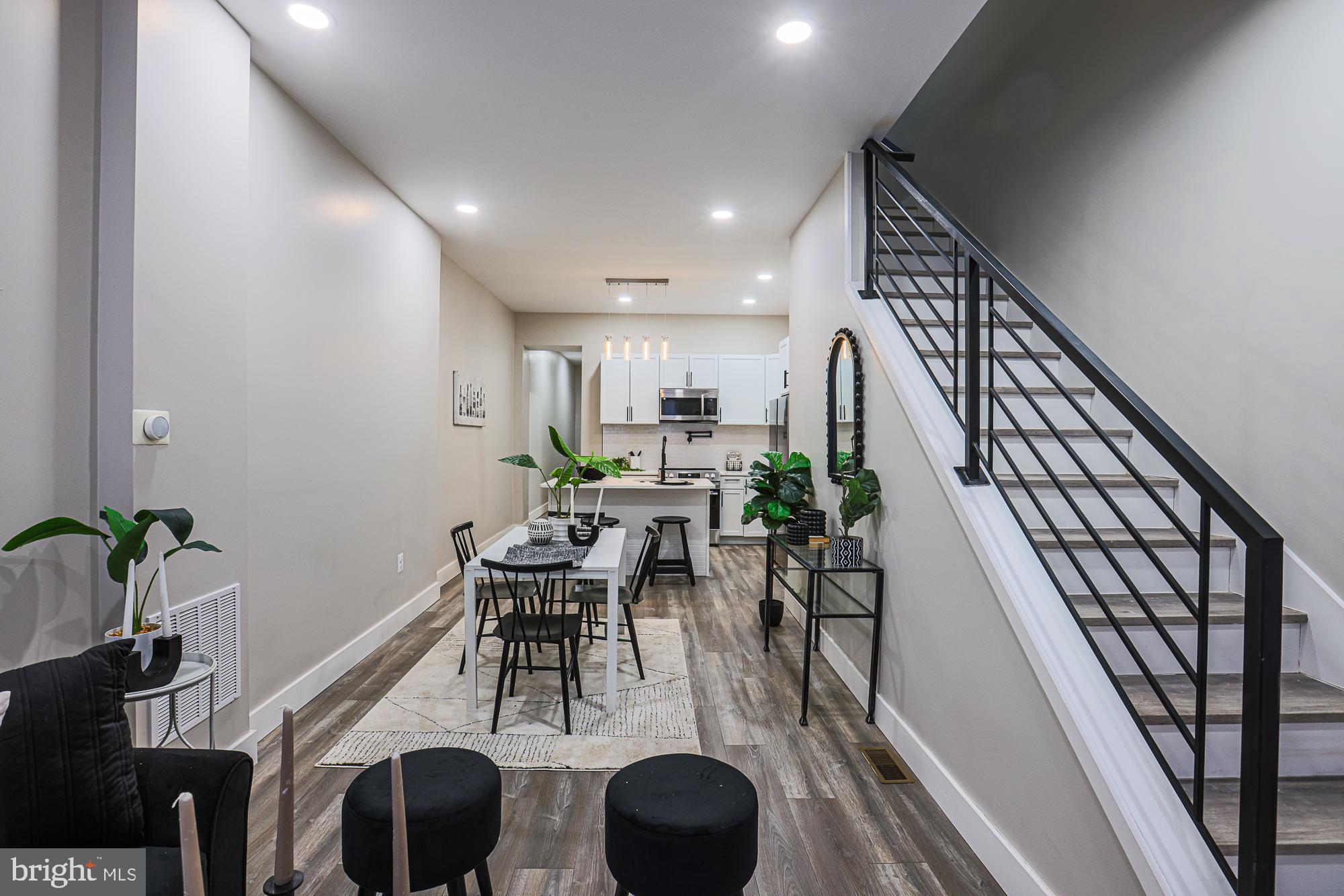 1728 Ruxton Avenue Baltimore, MD 21216 - Photo 41 of 43 a view of a dining room with furniture and wooden floor