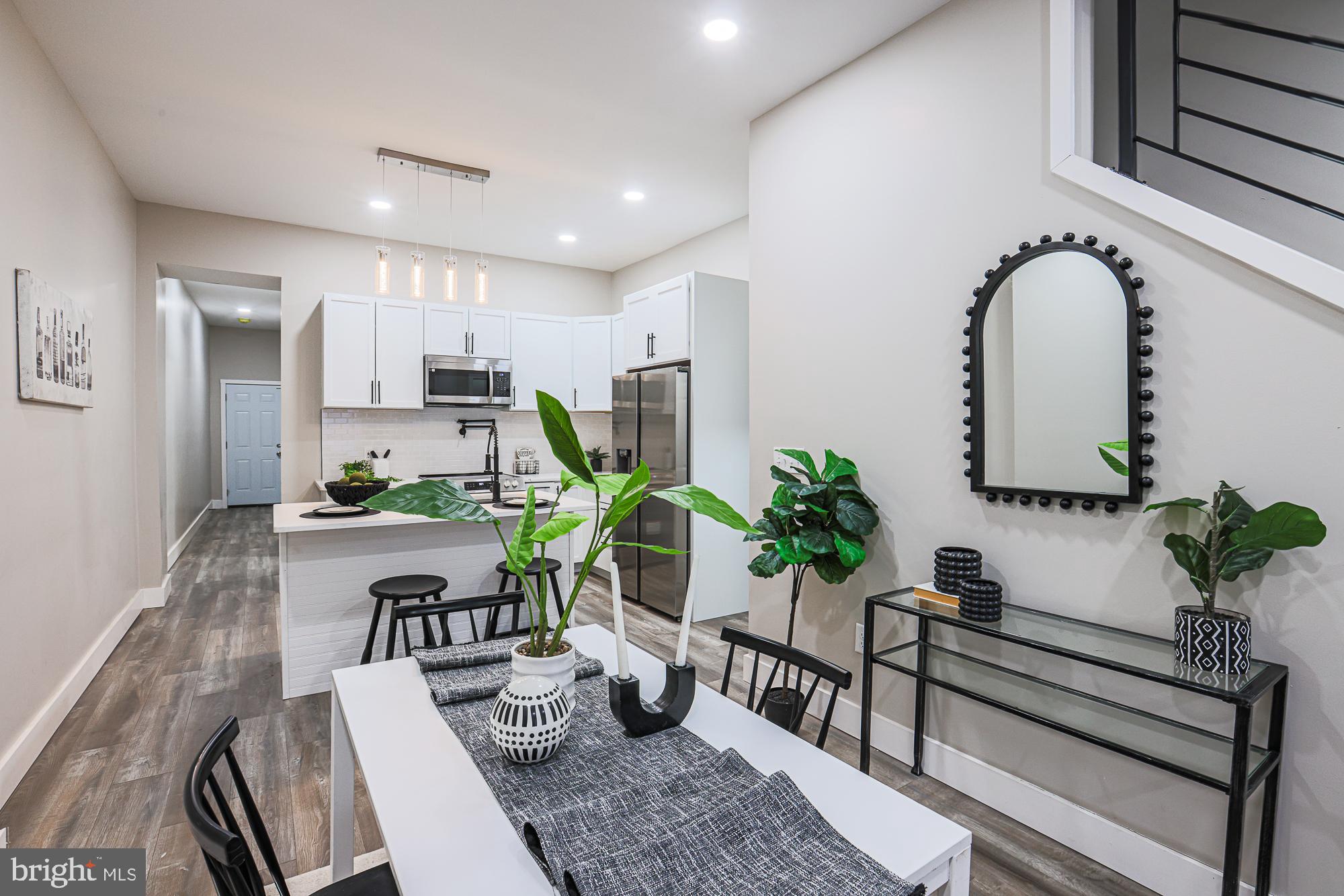 1728 Ruxton Avenue Baltimore, MD 21216 - Photo 8 of 43 a living room with furniture potted plant and a window