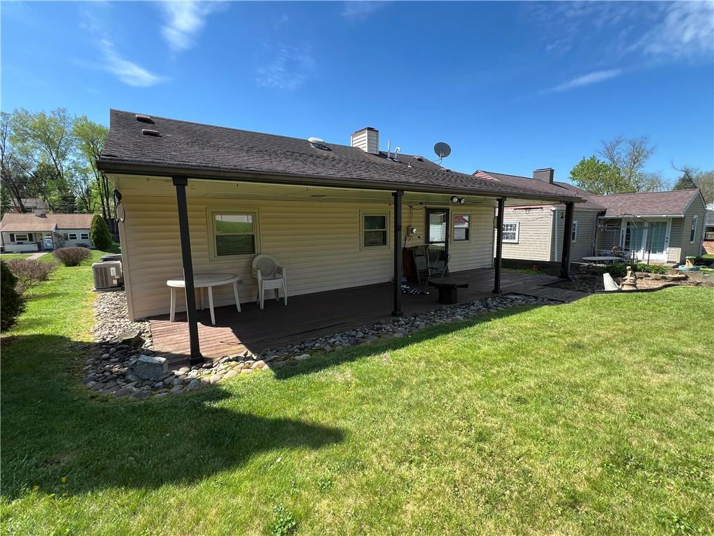 203 Carson Street Springdale, PA 15144 - Photo 26 of 43 a front view of a house with a yard and porch
