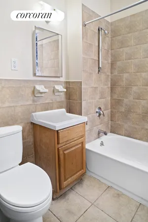 a bathroom with a sink a toilet and bathtub