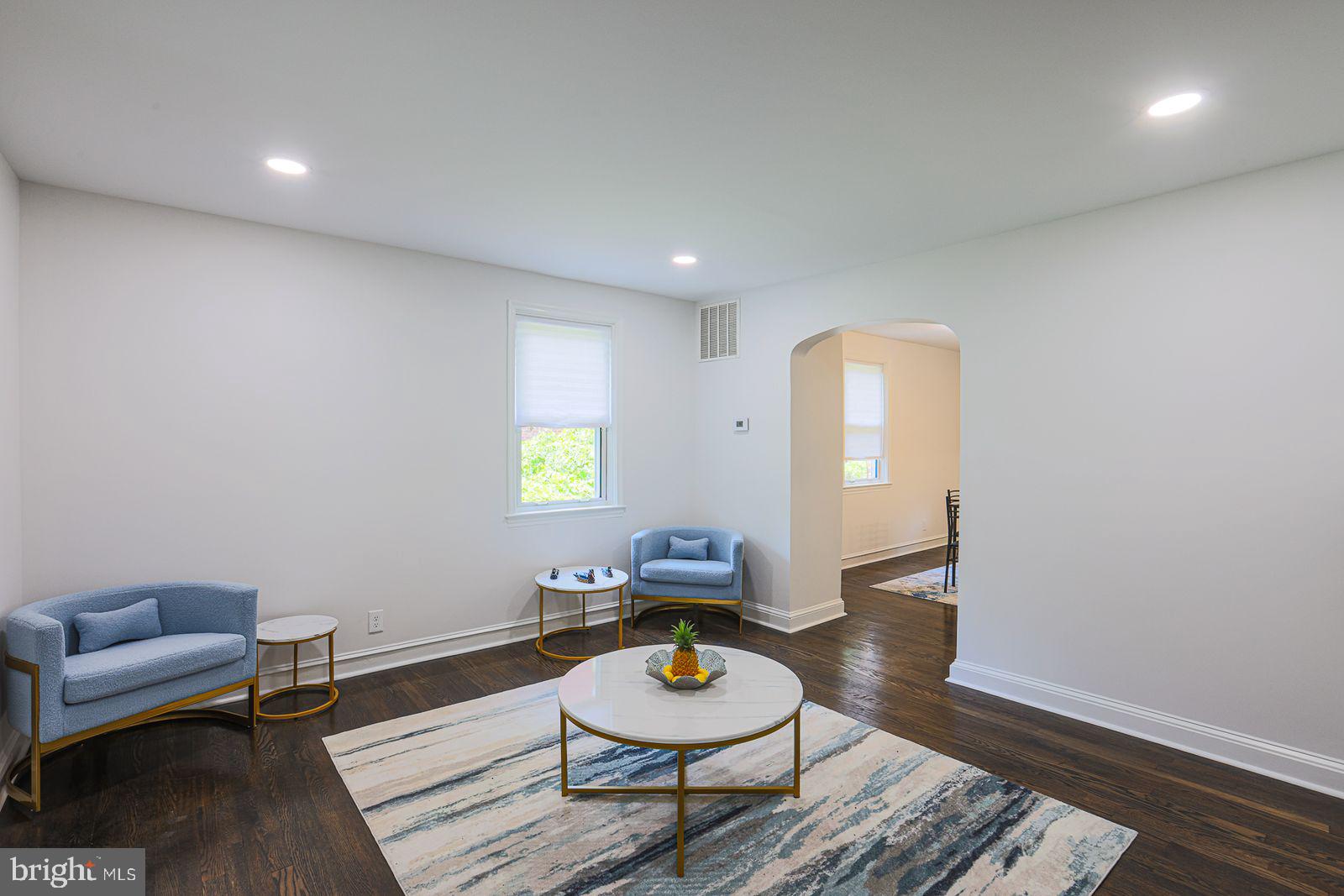 6203 Hopeton Avenue Baltimore, MD 21215 - Photo 16 of 18 a living room with furniture and a wooden floor