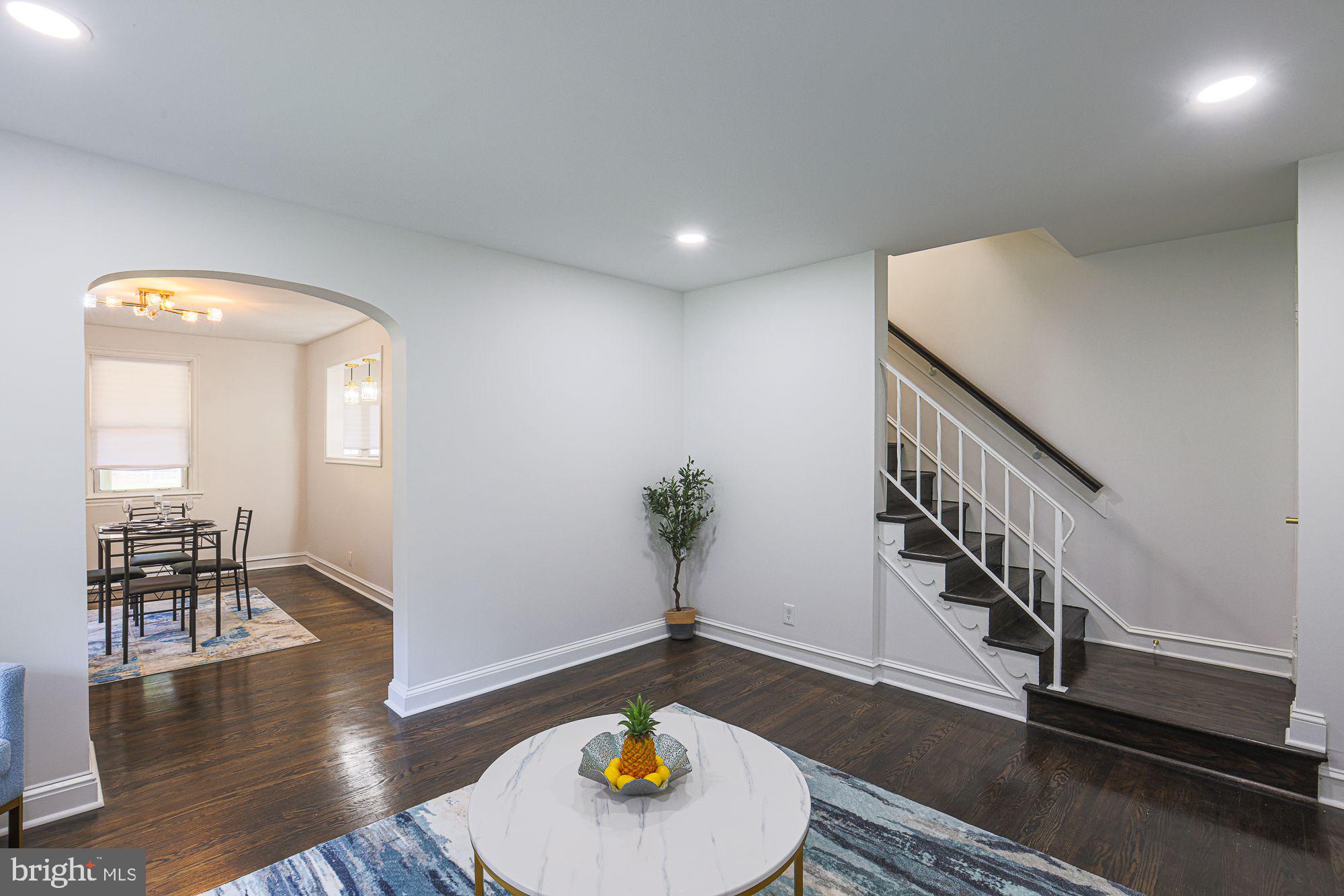 6203 Hopeton Avenue Baltimore, MD 21215 - Photo 5 of 18 a living room with furniture and a wooden floor