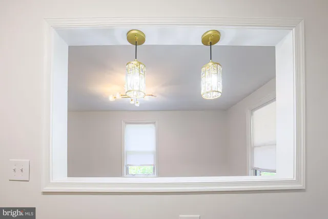a close view of light fixtures and window in a room