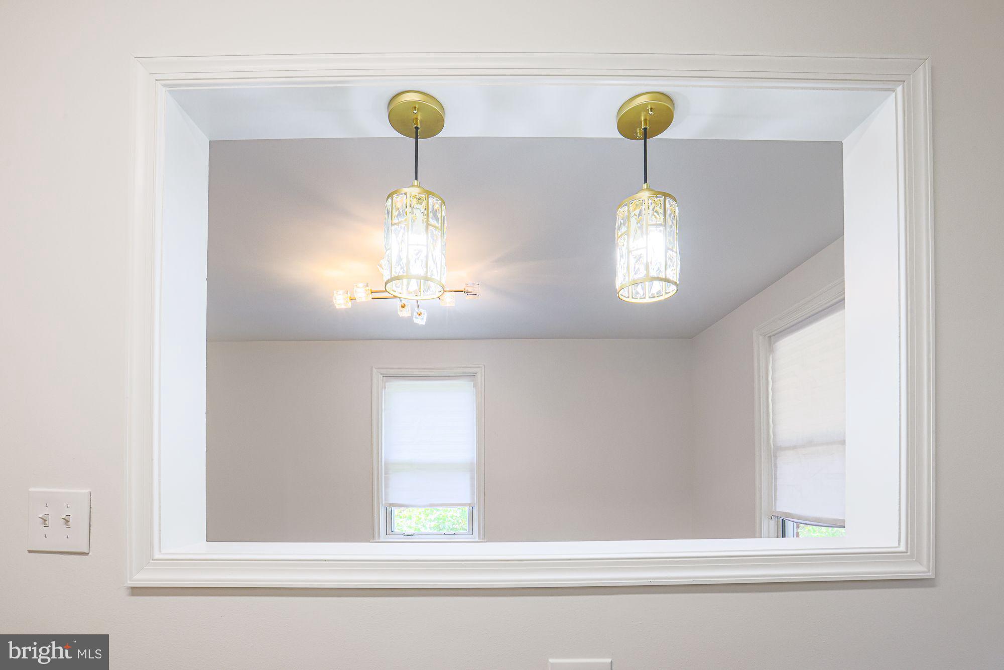 6203 Hopeton Avenue Baltimore, MD 21215 - Photo 8 of 18 a close view of light fixtures and window in a room
