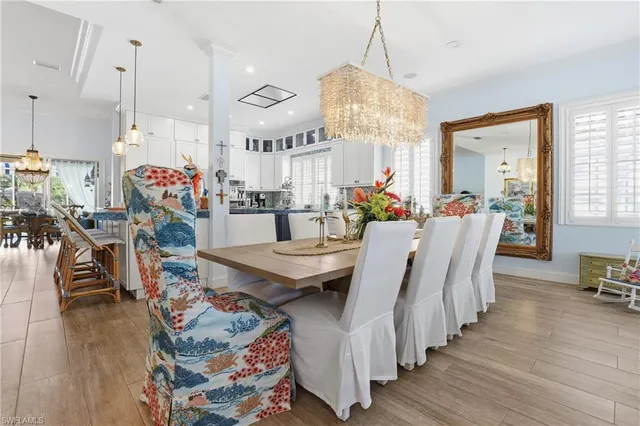 a very nice looking living room with wooden floor and furniture