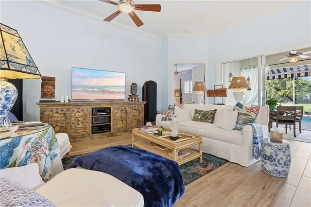 a living room with furniture fireplace and flat screen tv