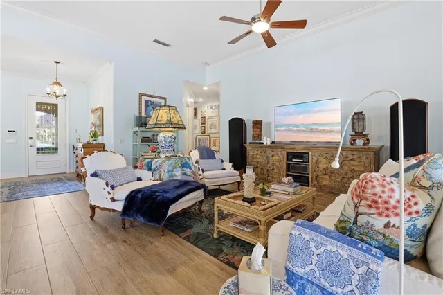 a living room with furniture fireplace and flat screen tv