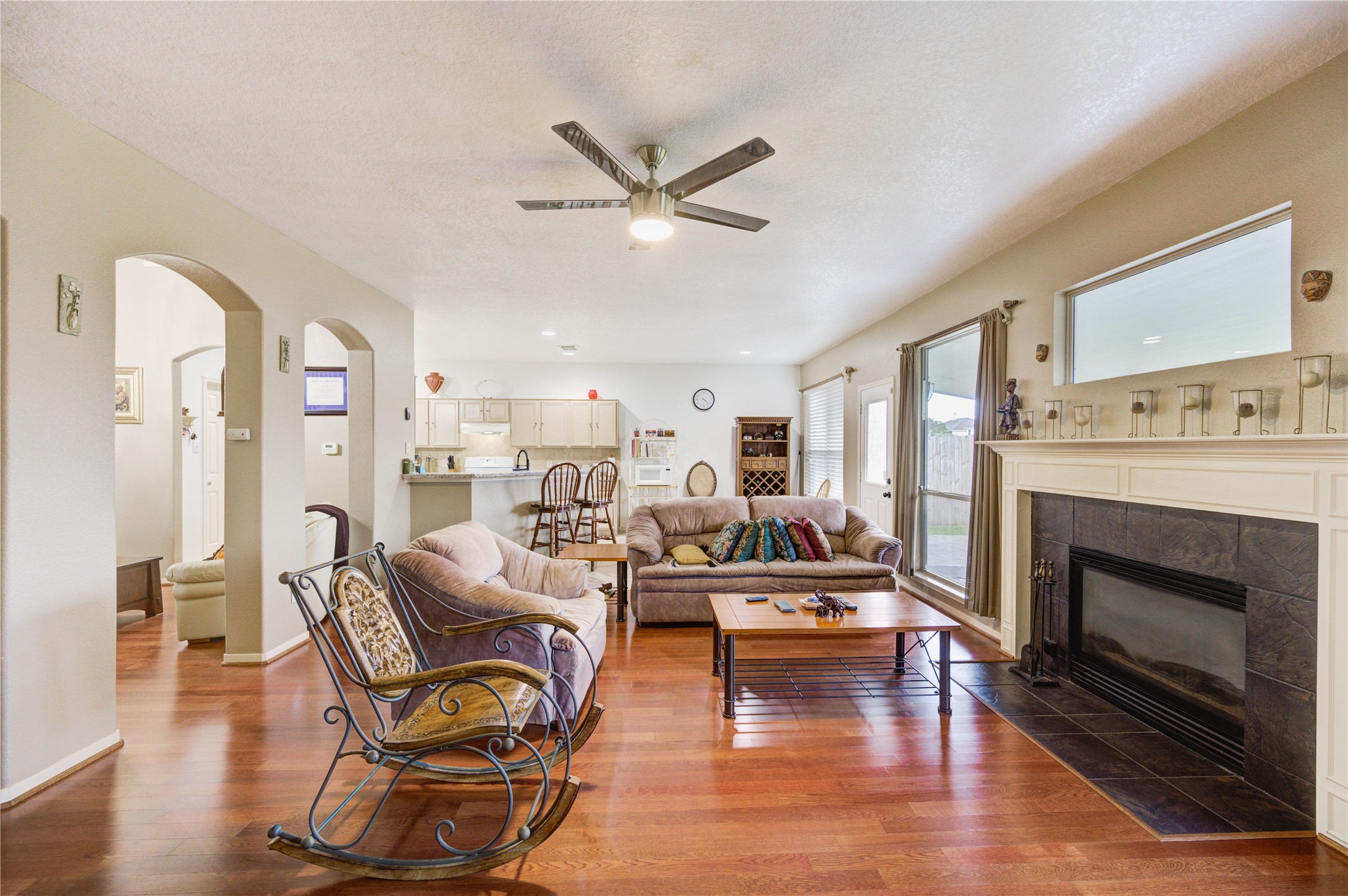 16730 Spring Barker Drive Cypress, TX 77429 - Photo 15 of 50 a living room with furniture and a fireplace