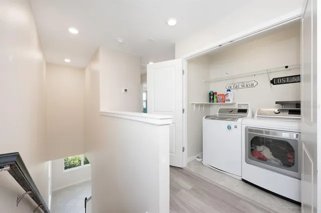 a view of a kitchen with a sink and dishwasher cabinet wooden floor