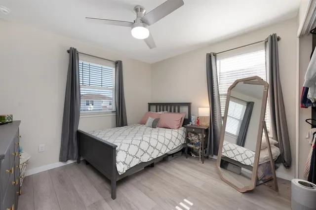 a front view of a house with a yard and a garage