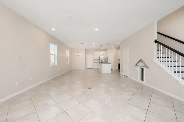 a view of an empty room and a window