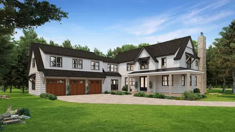 front view of a brick house with a yard