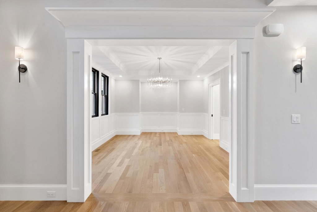 969 South Street Needham, MA 02492 - Photo 13 of 32 a view of a big room with wooden floor and windows