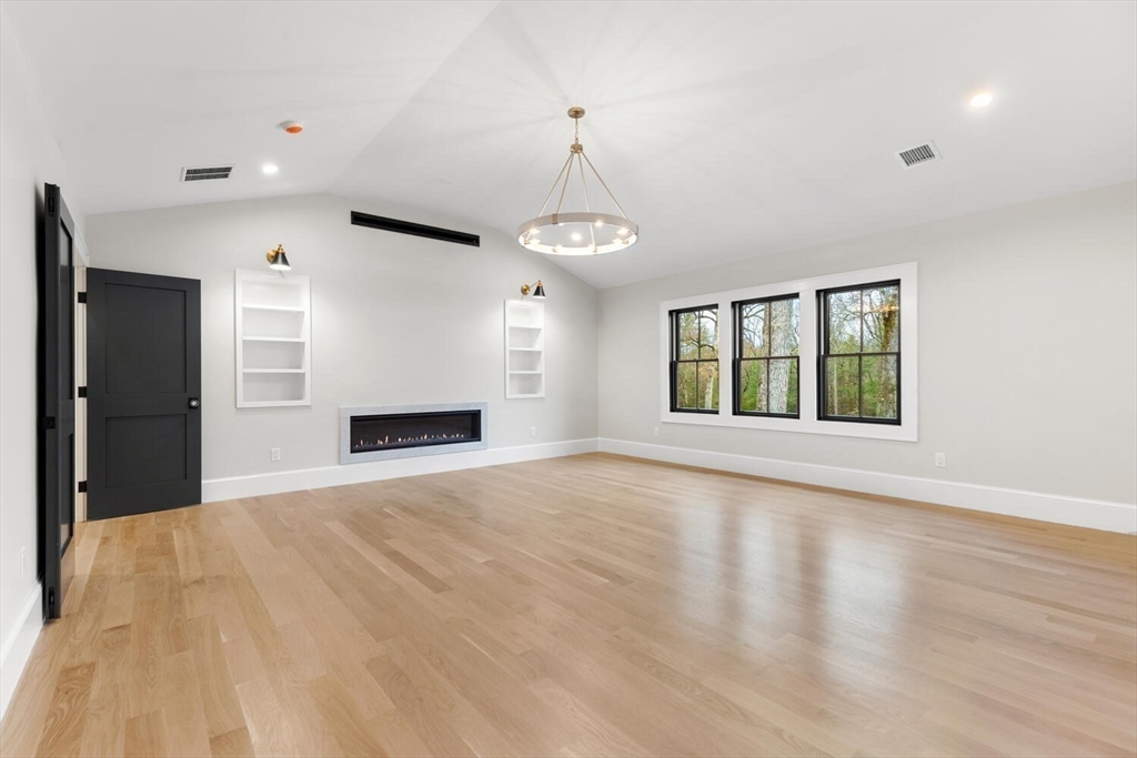 969 South Street Needham, MA 02492 - Photo 15 of 32 a view of an empty room with a window and fireplace
