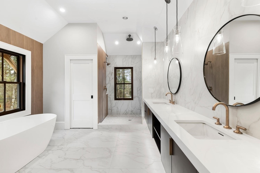 969 South Street Needham, MA 02492 - Photo 16 of 32 a spacious bathroom with a double vanity sink a mirror and a bathtub